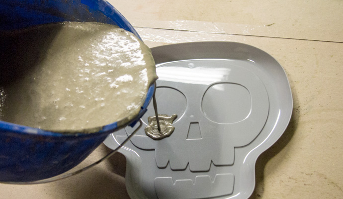 Pouring ShapeCrete into skull tray form